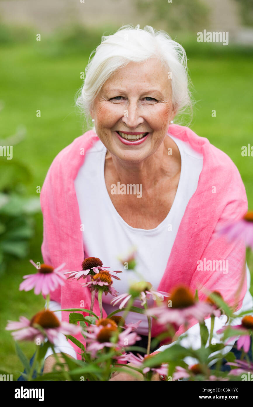 Portrait of senior woman in garden Stock Photo - Alamy