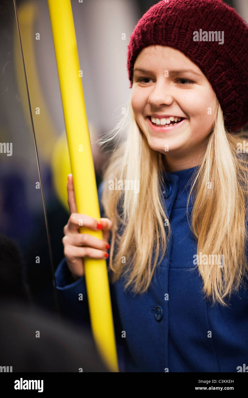 Teenage girl (14-15) in underground train Stock Photo