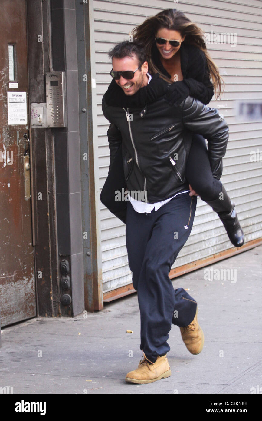 Tiger Woods' alleged mistress Rachel Uchitel gets a piggyback ride to ...