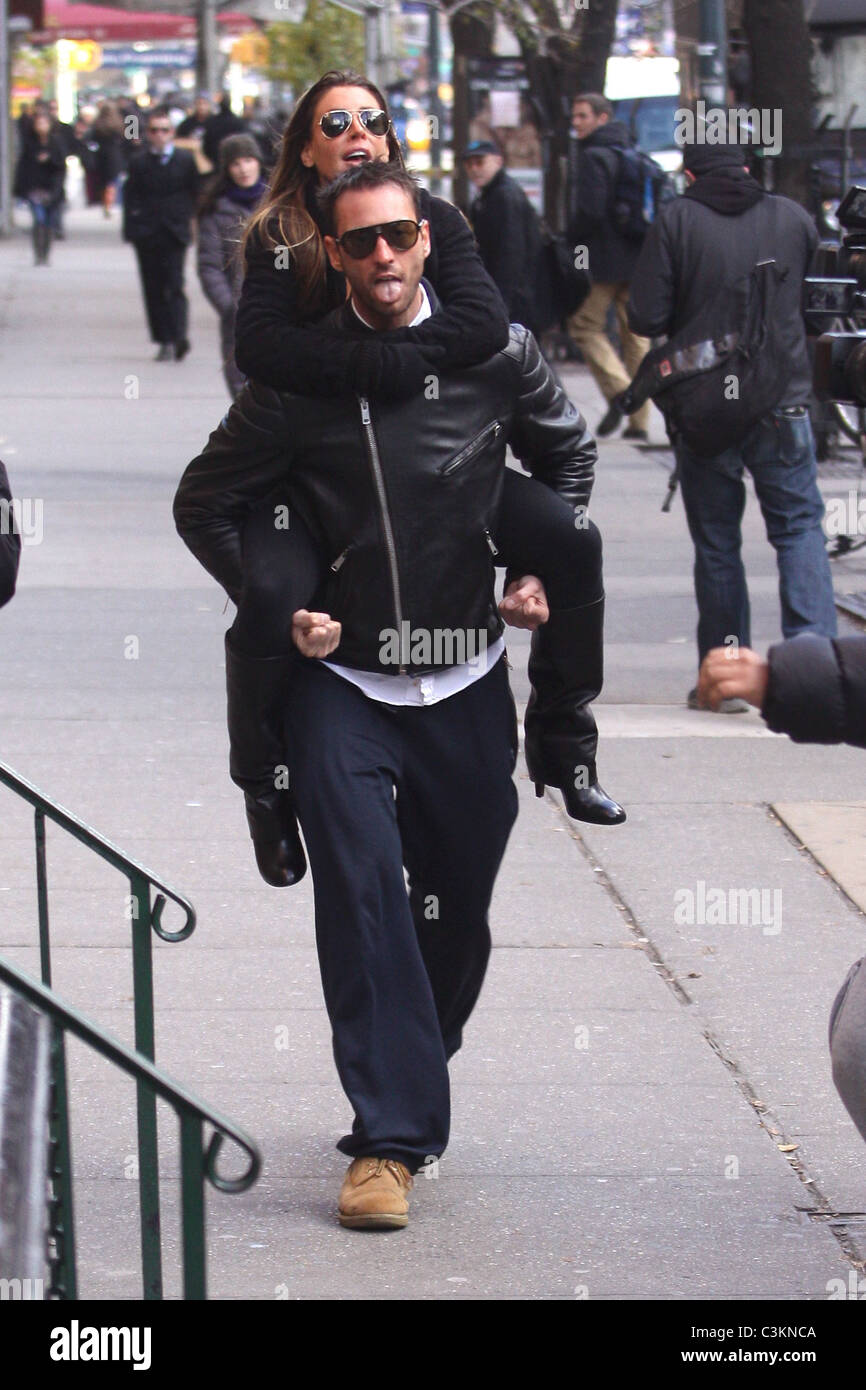 Tiger Woods' alleged mistress Rachel Uchitel gets a piggyback ride to ...