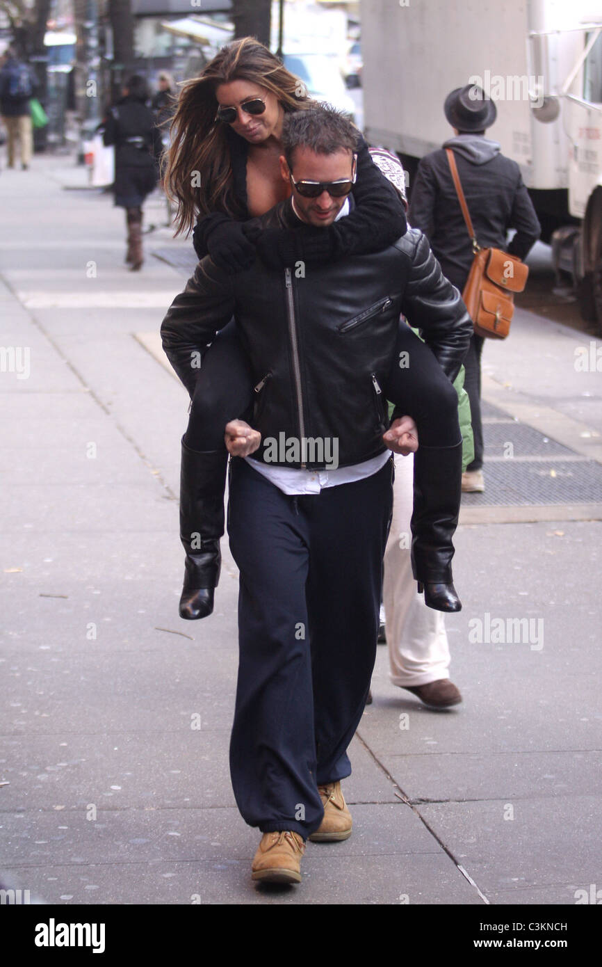 Tiger Woods' alleged mistress Rachel Uchitel gets a piggyback ride to ...