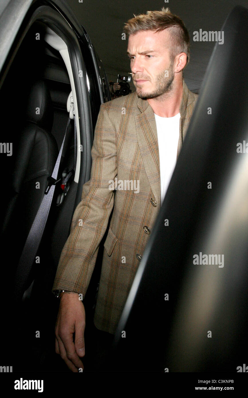 David Beckham arrives at Los Angeles International Airport wearing