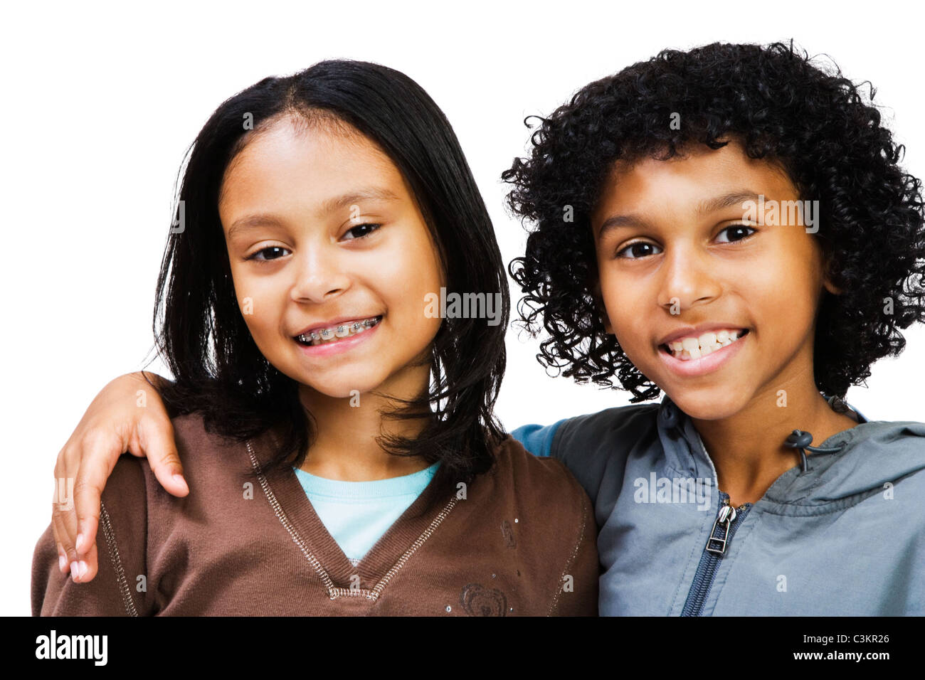 Portrait of two girls smiling isolated over white Stock Photo - Alamy