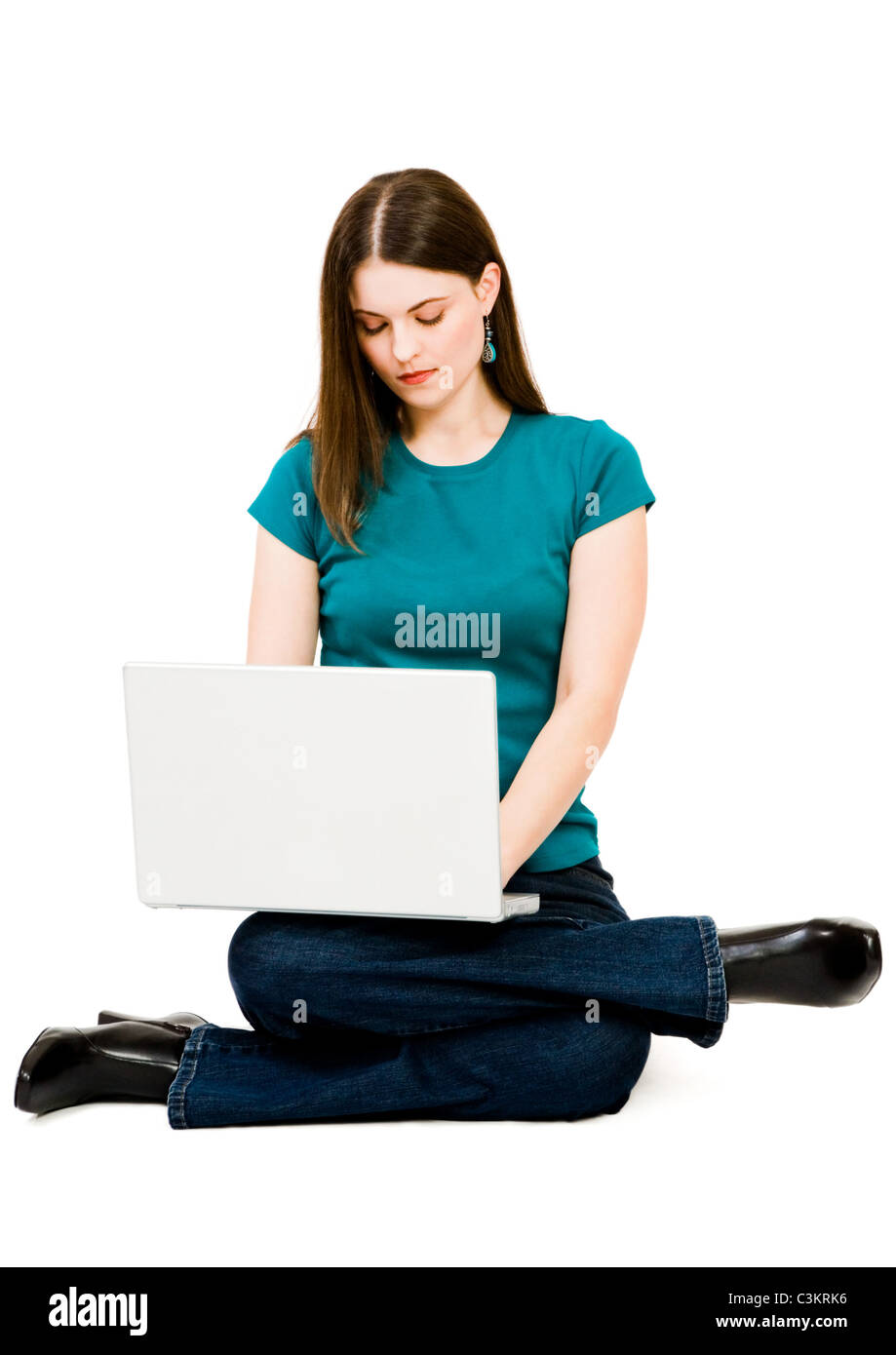 Young woman using a laptop isolated over white Stock Photo - Alamy