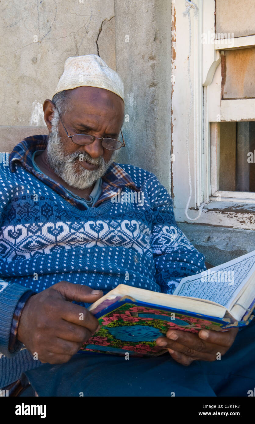 Man reading the Koran, Bo-Kaap, Cape Town, South Africa Stock Photo