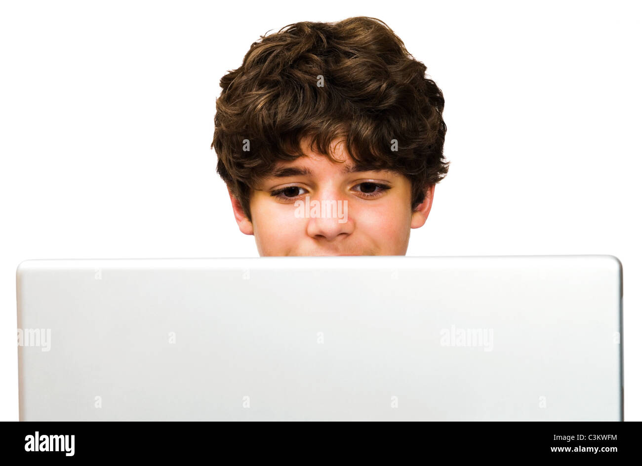 Caucasian boy using a laptop isolated over white Stock Photo - Alamy