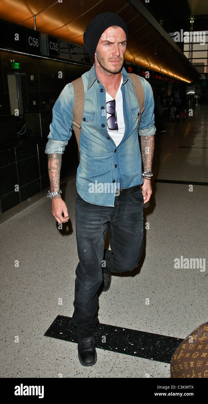 David Beckham arrives at Los Angeles International Airport wearing