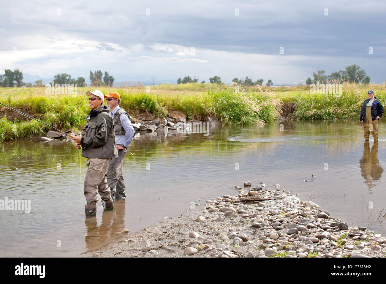 President Barack Obama and local fishing guide Dan Vermillion fish for ...