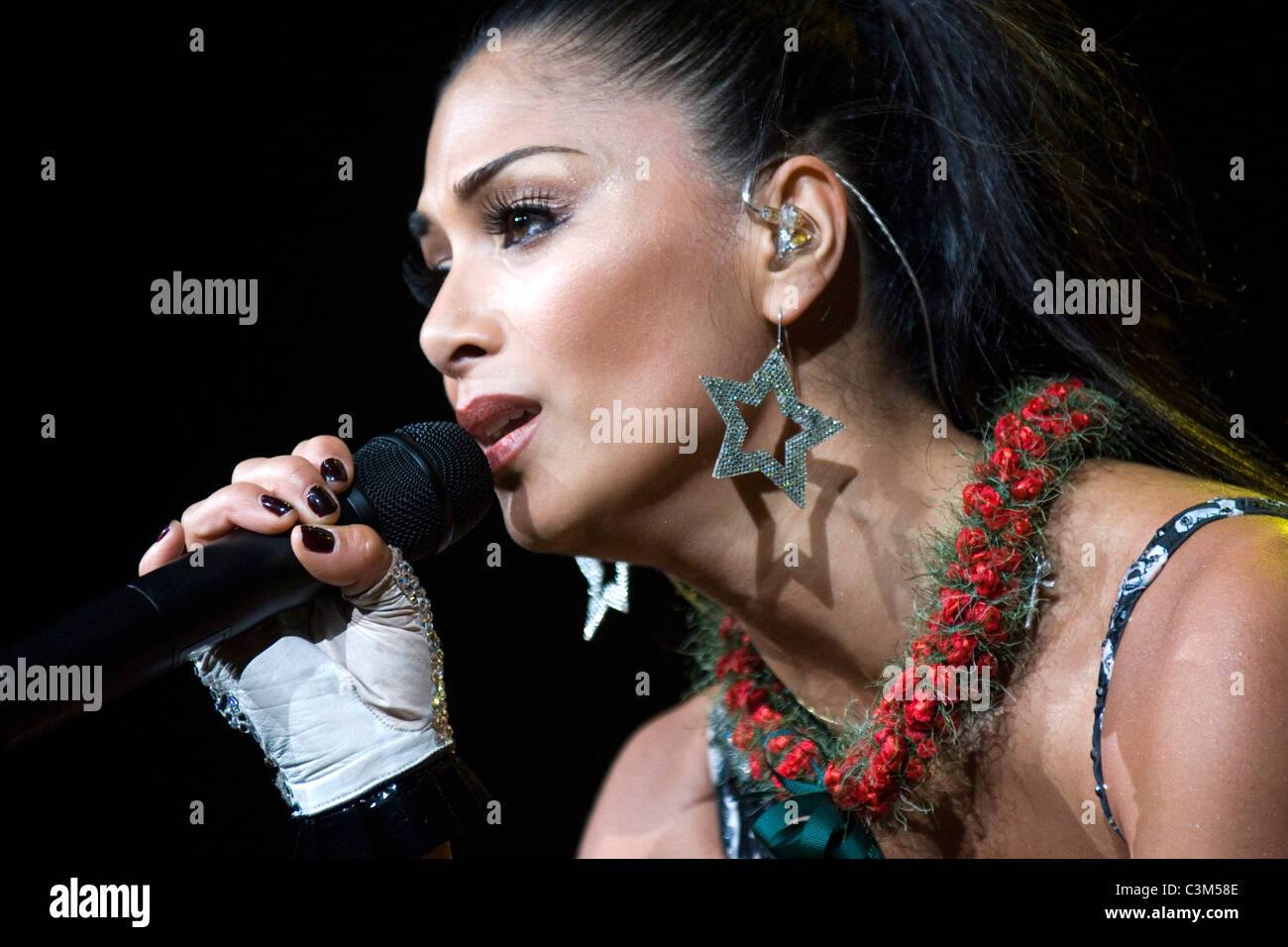 Nicole Scherzinger with a Hawaiian lei around her neck, after her opening  song in her hometown with the Pussy Cat Dolls at the Stock Photo - Alamy