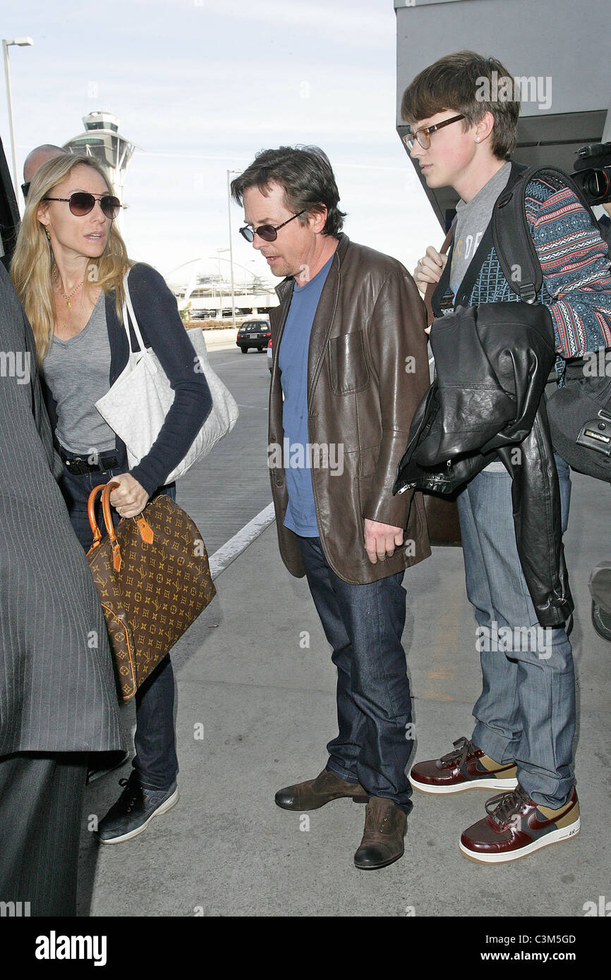 Michael J Fox arrives at LAX airport with his family and get in their ...