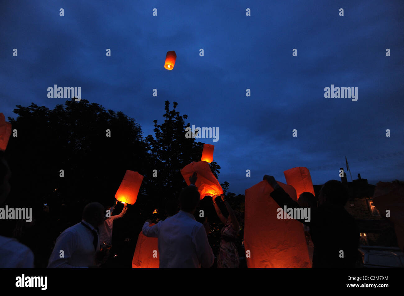 Chinese lanterns are launched at a wedding party Stock Photo