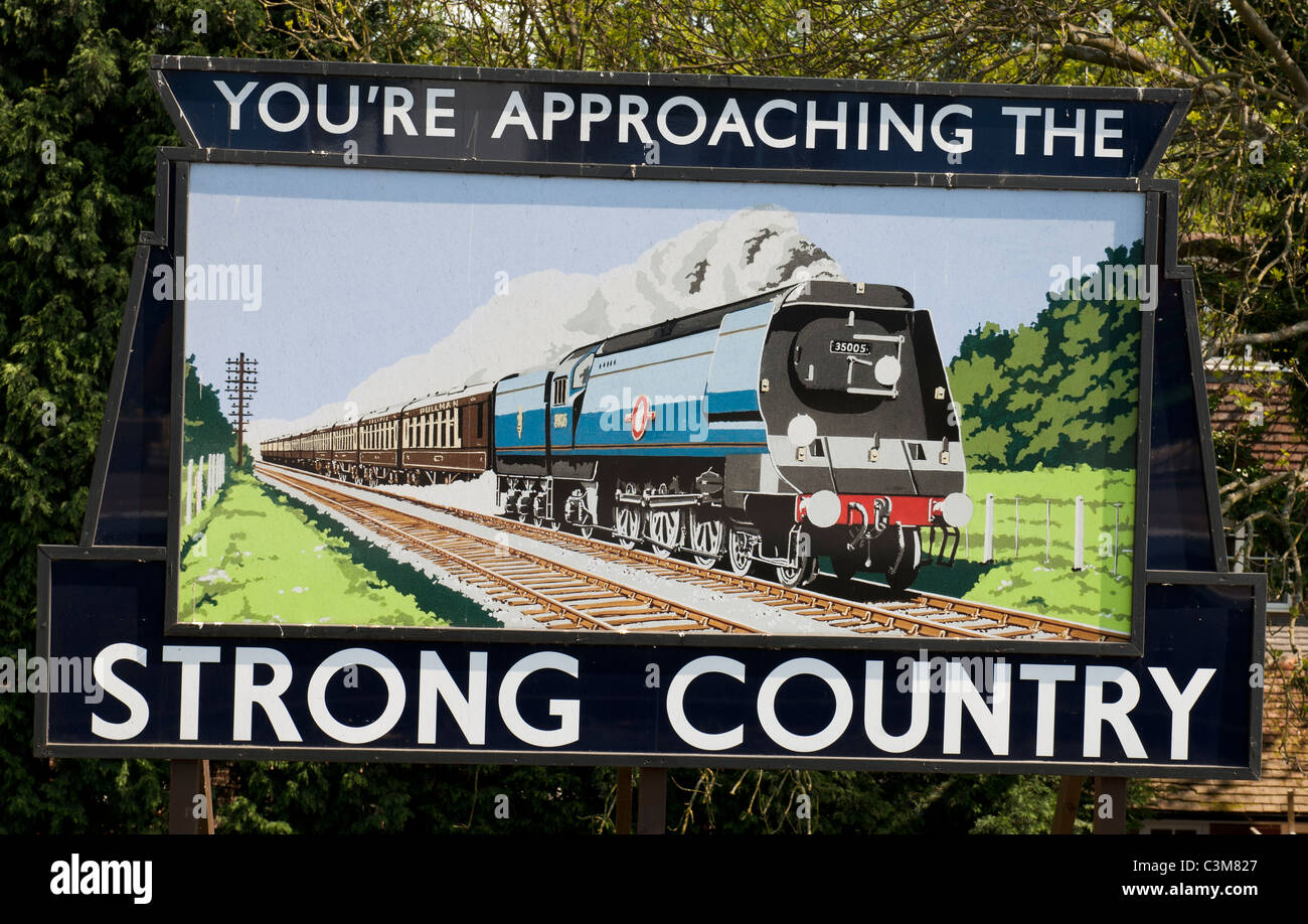 Advert hoarding for 'Strong Country' at Alton Railway Station, Alton, Hampshire, England, UK. Stock Photo