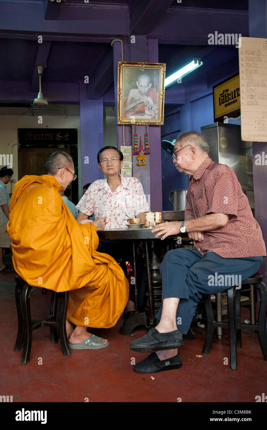 Monk and two friends drinking coffee in a shop of Bangkok Stock Photo ...