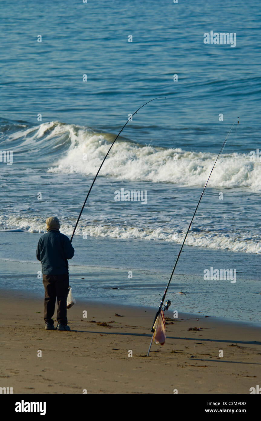 Surf fisherman fishing at El Capitan State Beach, near
