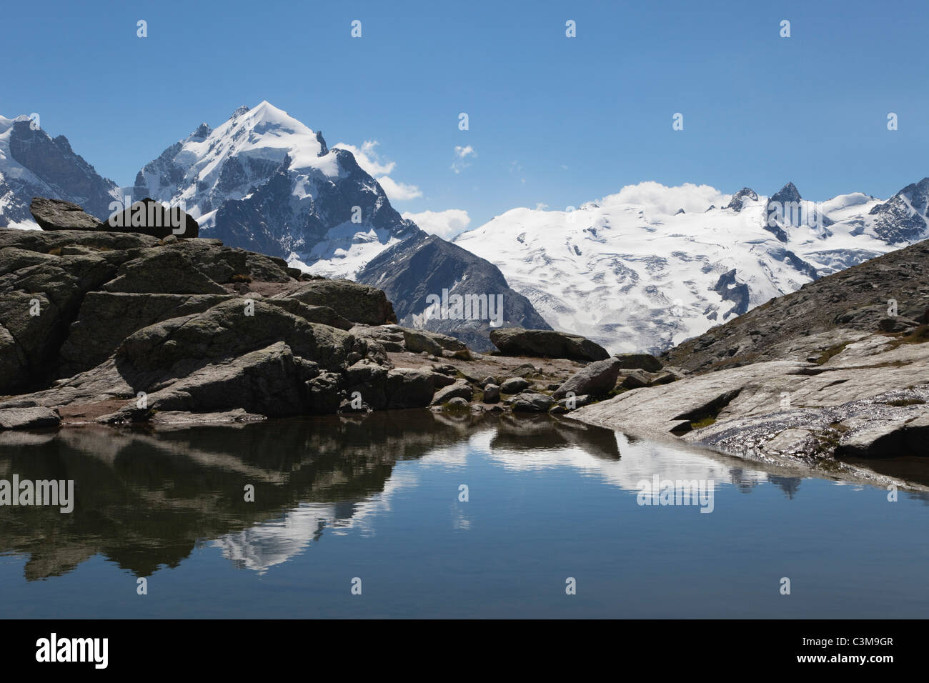 Europe, Switzerland, Grisons, South Engadin Alps, Upper Engadin, View of mountain peaks near Fuorcla Surley lake Stock Photo
