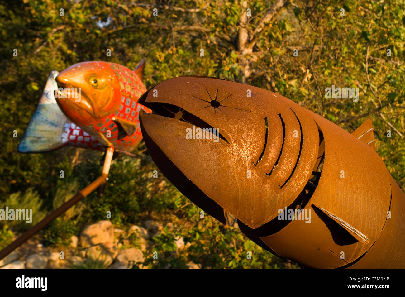 Metal art sculptures of native american motif salmon El Capitan Canyon Resort, near Santa Barbara, California Stock Photo