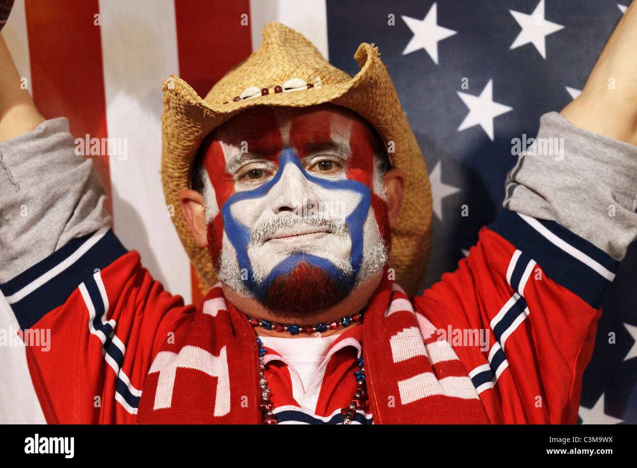 A USA supporter reacts after the United States defeated Algeria on a dramatic late goal in a 2010 FIFA World Cup Group C match. Stock Photo