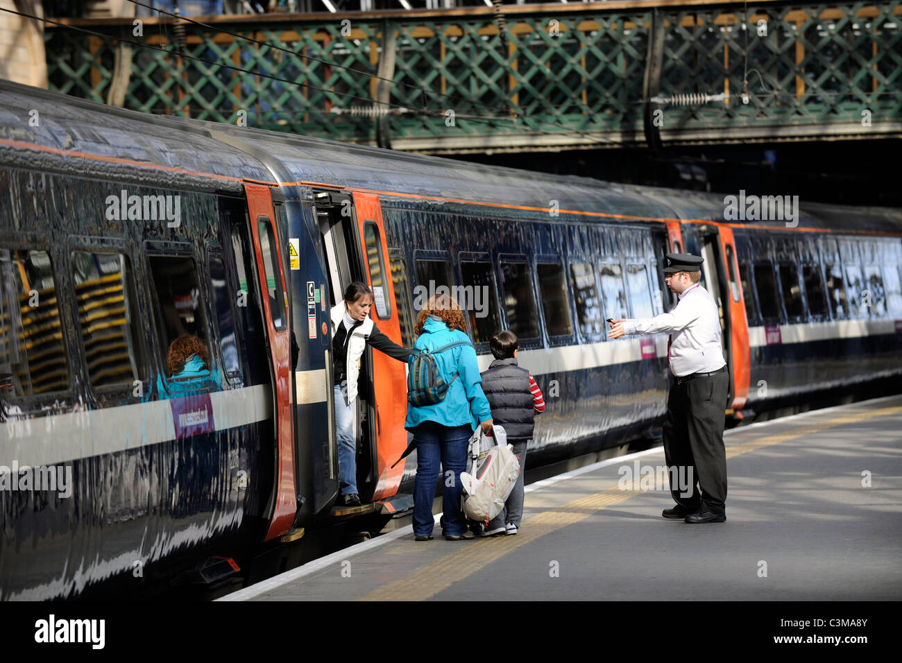 Boarding a train at, Edinburgh Waverly Station, Edinburgh, Scotland. Stock Photo