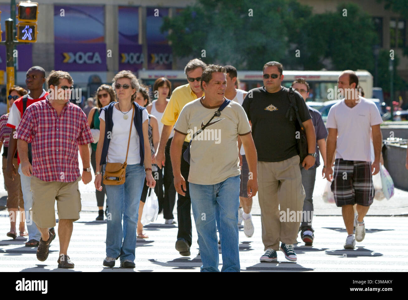 Pedestrians on Avenida 9 de Julio in Buenos Aires, Argentina. Stock Photo