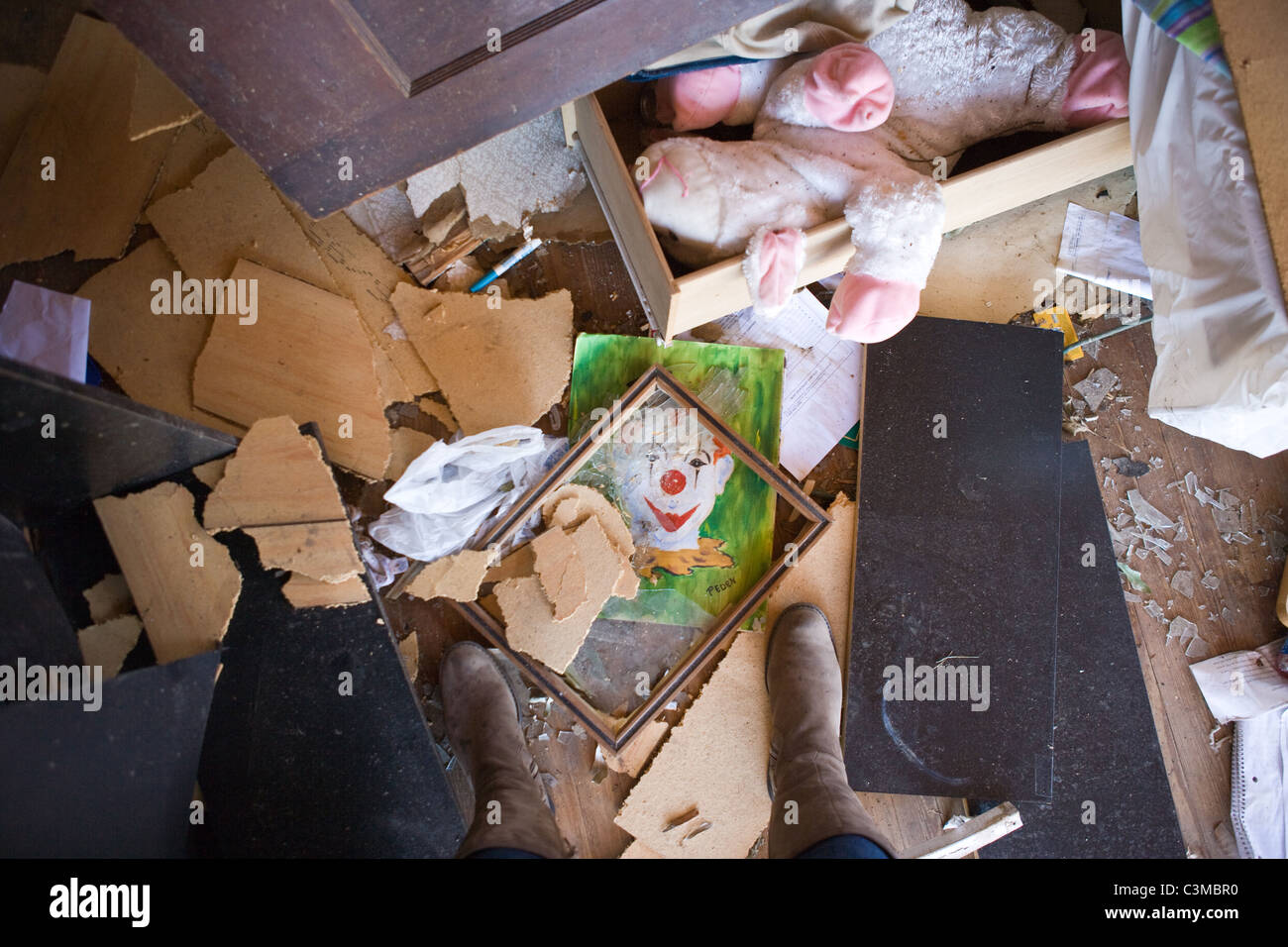 broken toys and drawings on the floor of a child's room after tornado destroyed home, Alabama, May 2011 Stock Photo