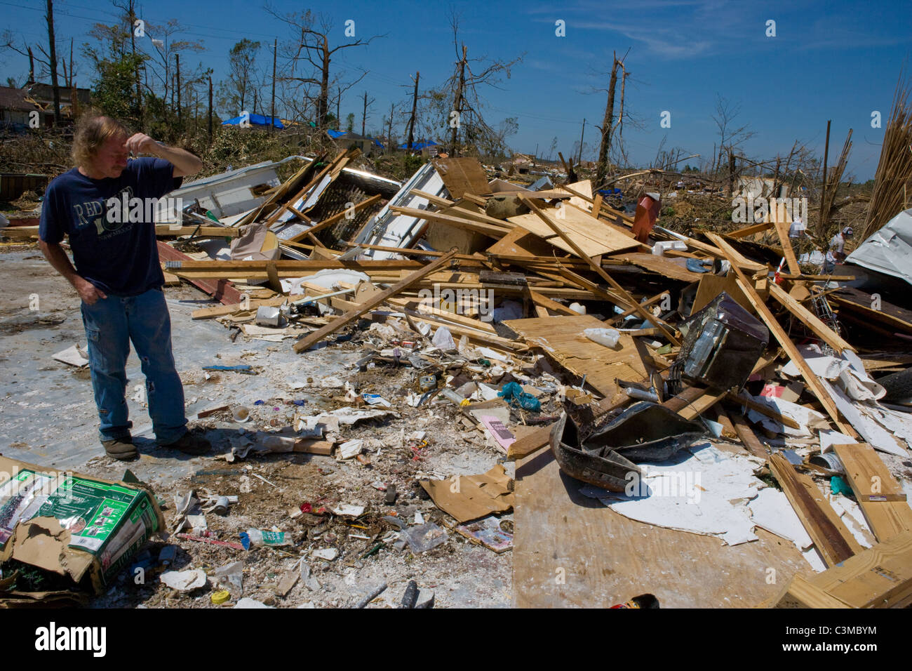 A man surveys devastation of home after worst tornado in history, Pleasant Grove, Alabama, USA, May 2011 Stock Photo