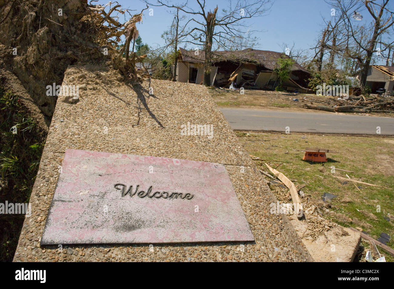 A welcome mat laying on broken porch after tornado hit Tuscaloosa Alabama, May 2011 Stock Photo