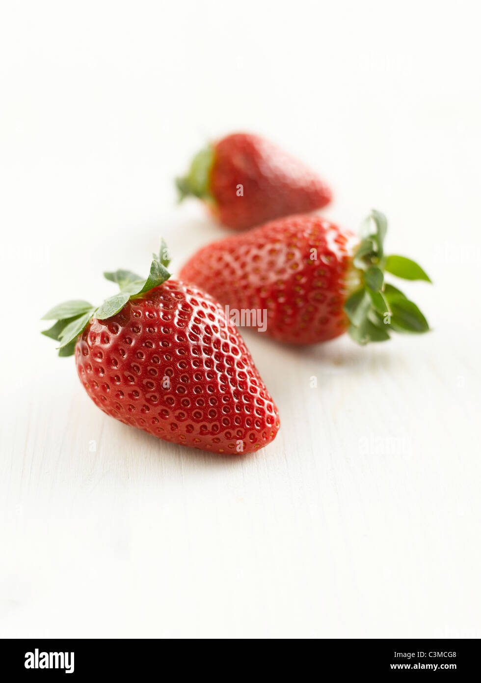Three strawberries hi-res stock photography and images - Alamy