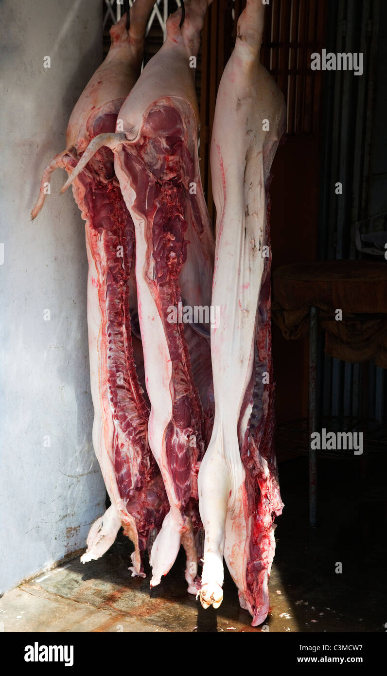 Pigs Cut in Half Hanging in the Street, Penang Stock Photo