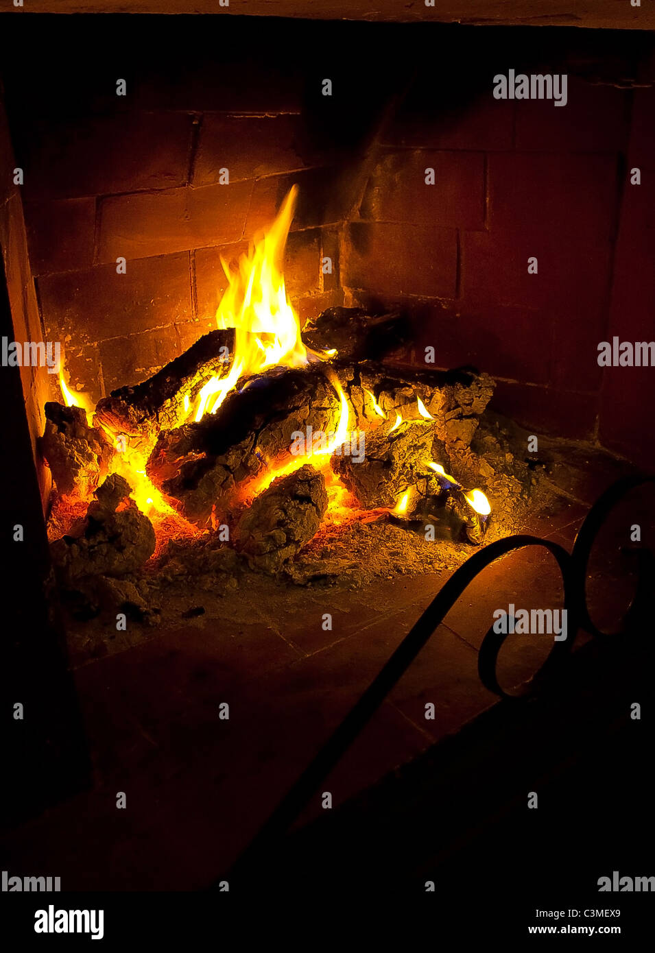 Logs burning in fireplace Stock Photo Alamy