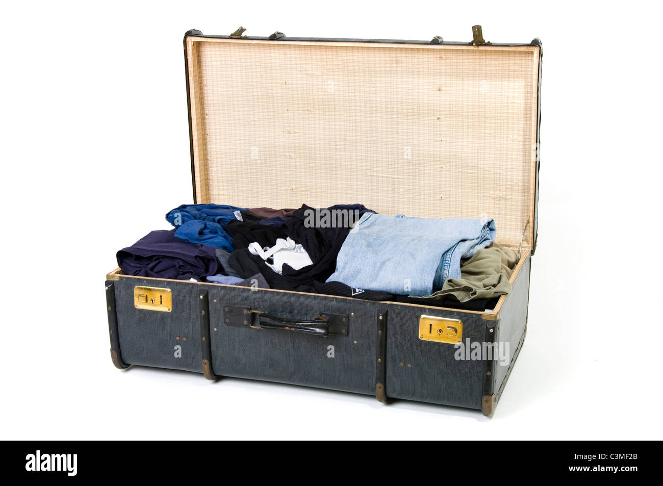 Open suitcase with clothes on white background Stock Photo