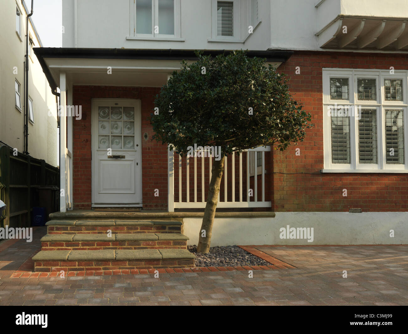 Porch Of Semi Detached House And Paved Over Front Garden England Stock