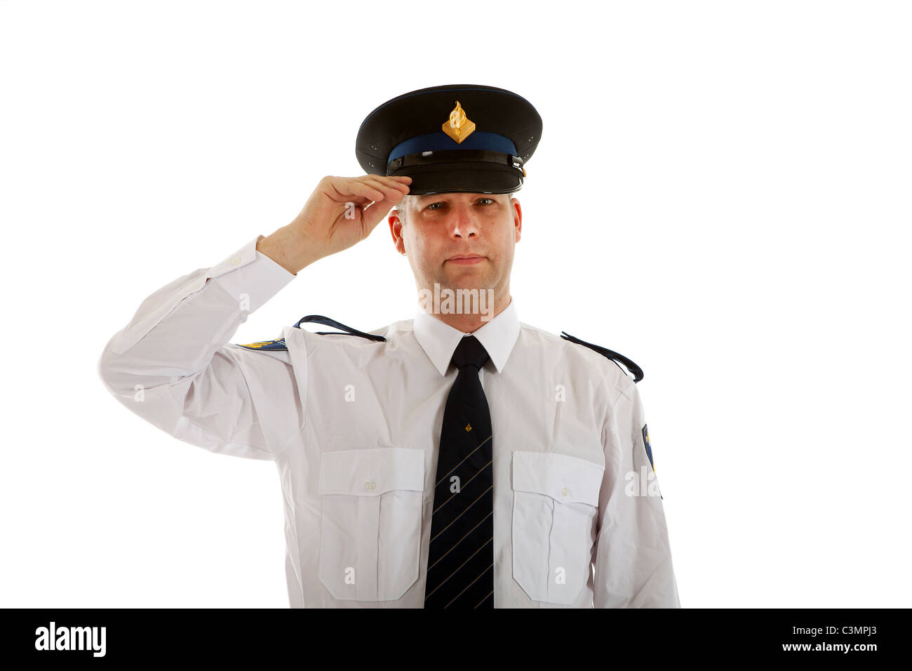 Police officer with hand on cap over white background Stock Photo