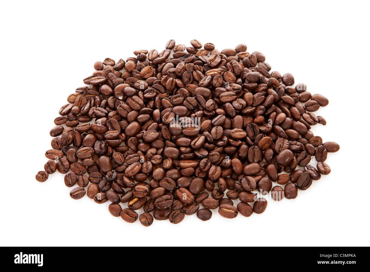 Pile of roasted coffee beans over white background Stock Photo - Alamy