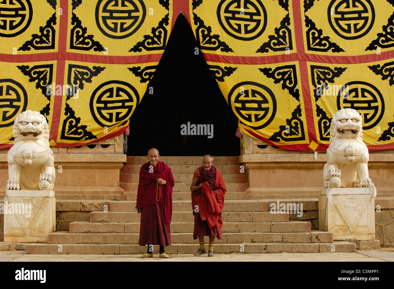 Two monks at Songzhanling Monastery. Zhongdian. Diqing Tibetan Autonymous Prefecture. Yunnan Province. China. No model release. Stock Photo
