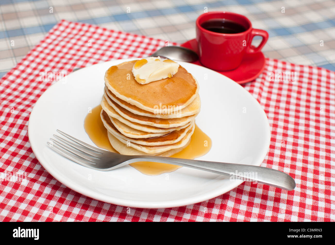 Pancakes With Butter and Maple Syrup Stock Photo