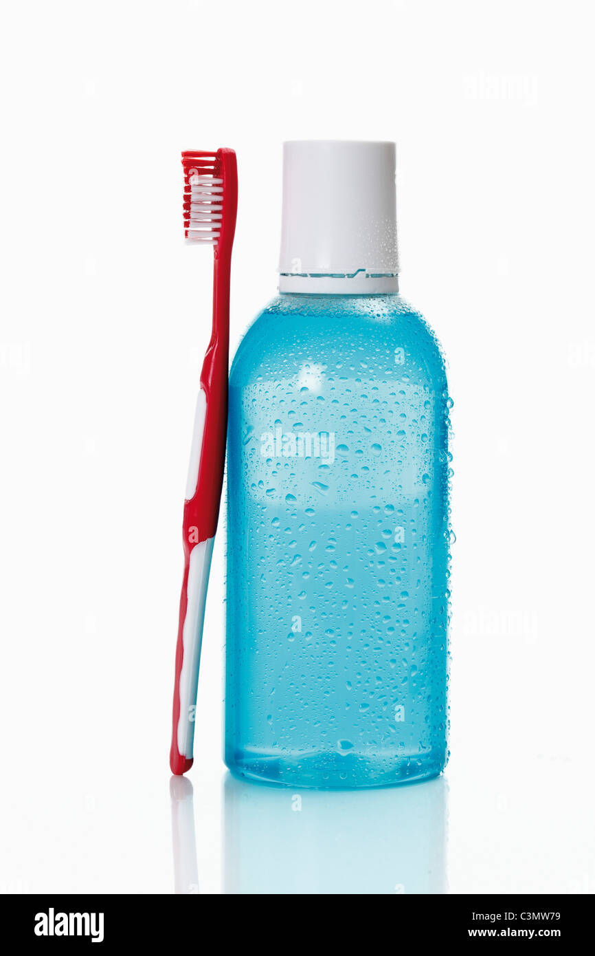 Toothbrush and mouthwash on white background Stock Photo Alamy