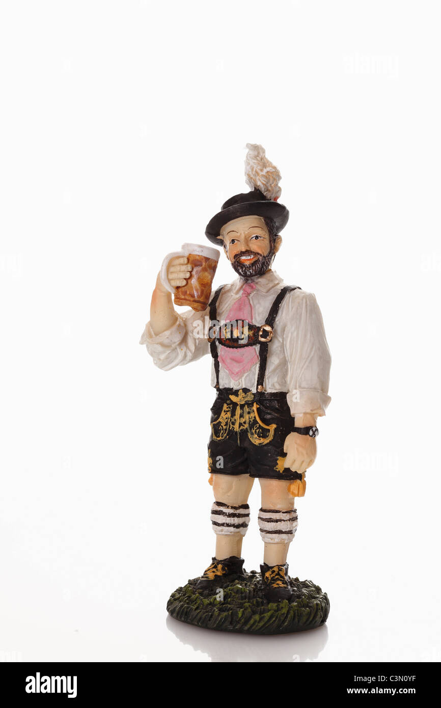 Bavarian figurine drinking beer from beer stein Stock Photo