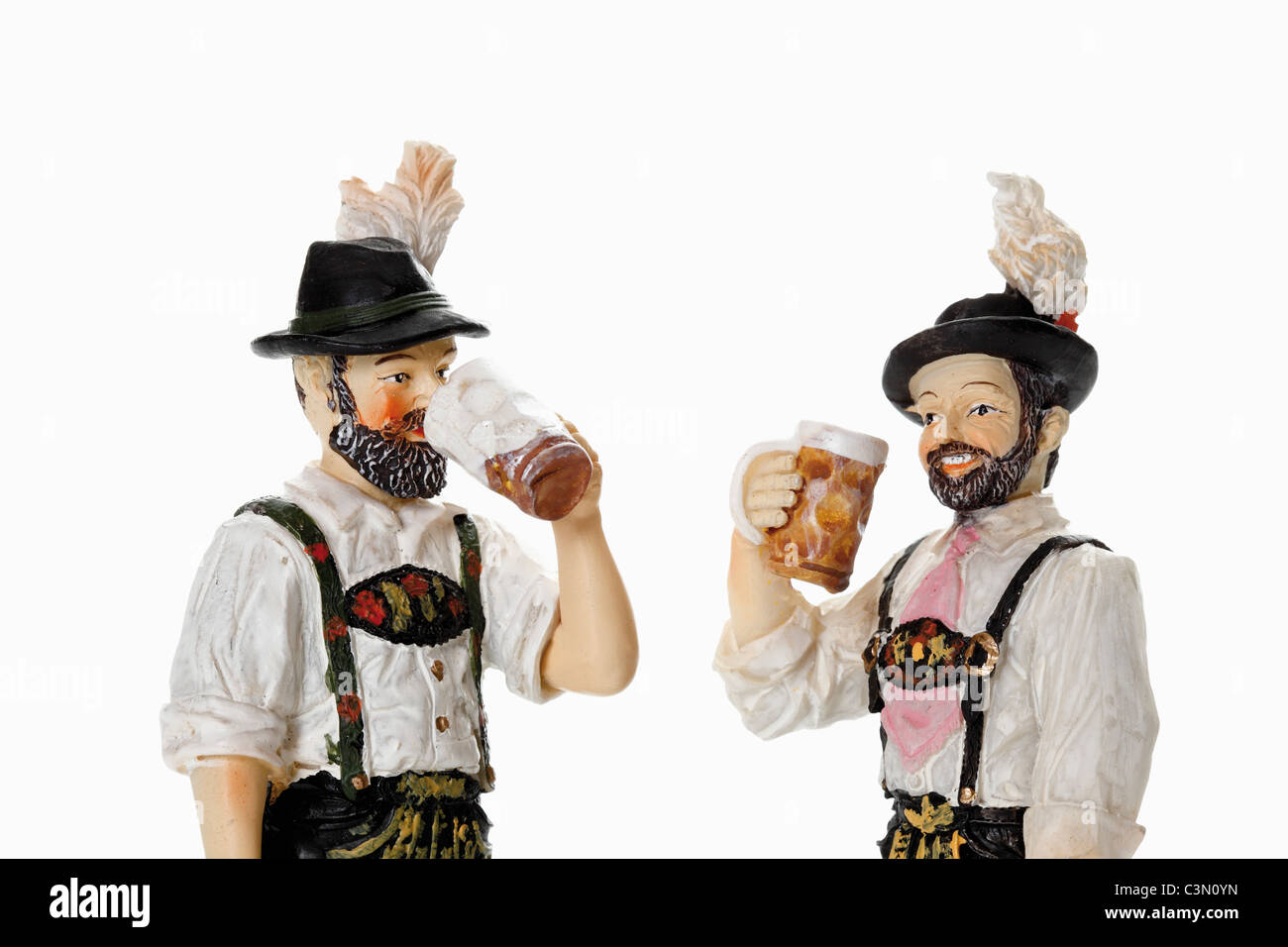 Bavarian figurines drinking beer from beer stein Stock Photo