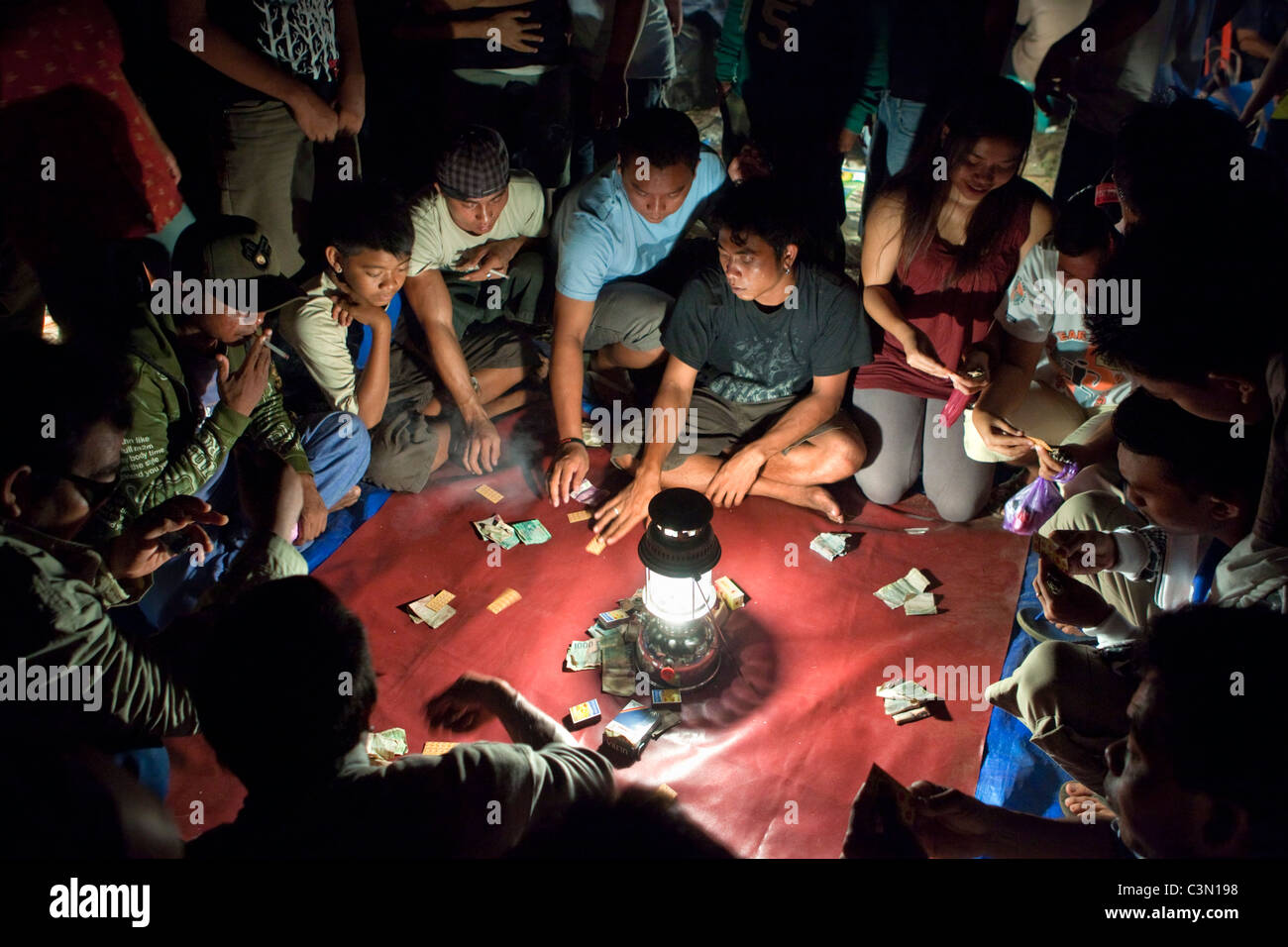 Indonesia, Bali island, Tejakula, Children playing games for money. Stock Photo