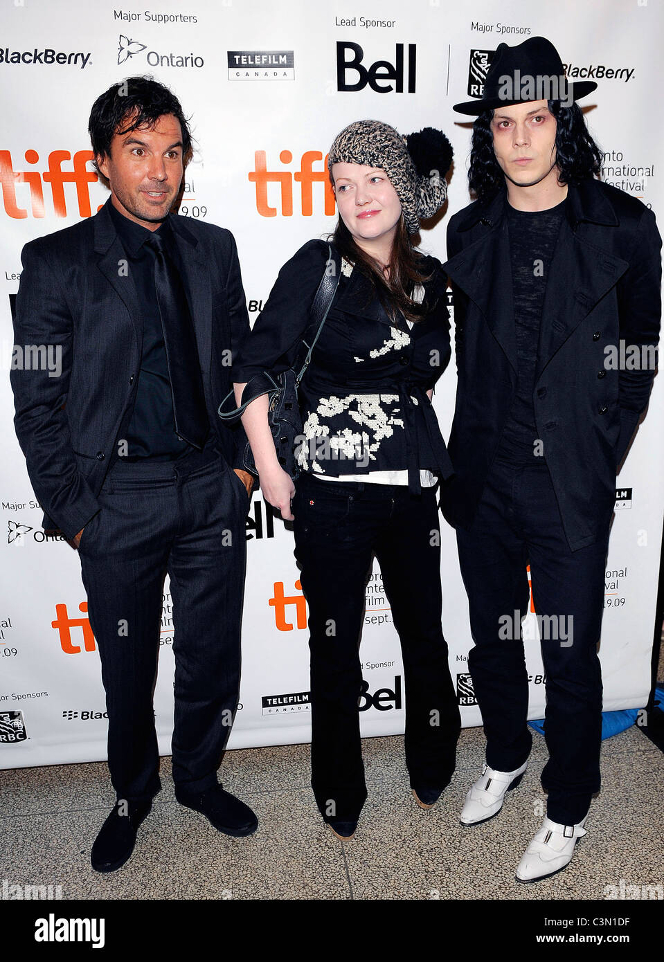 Director Emmett Malloy (L), Meg White and Jack White  Premiere of 'White Stripes: Under The Great White Northern Lights' - The Stock Photo