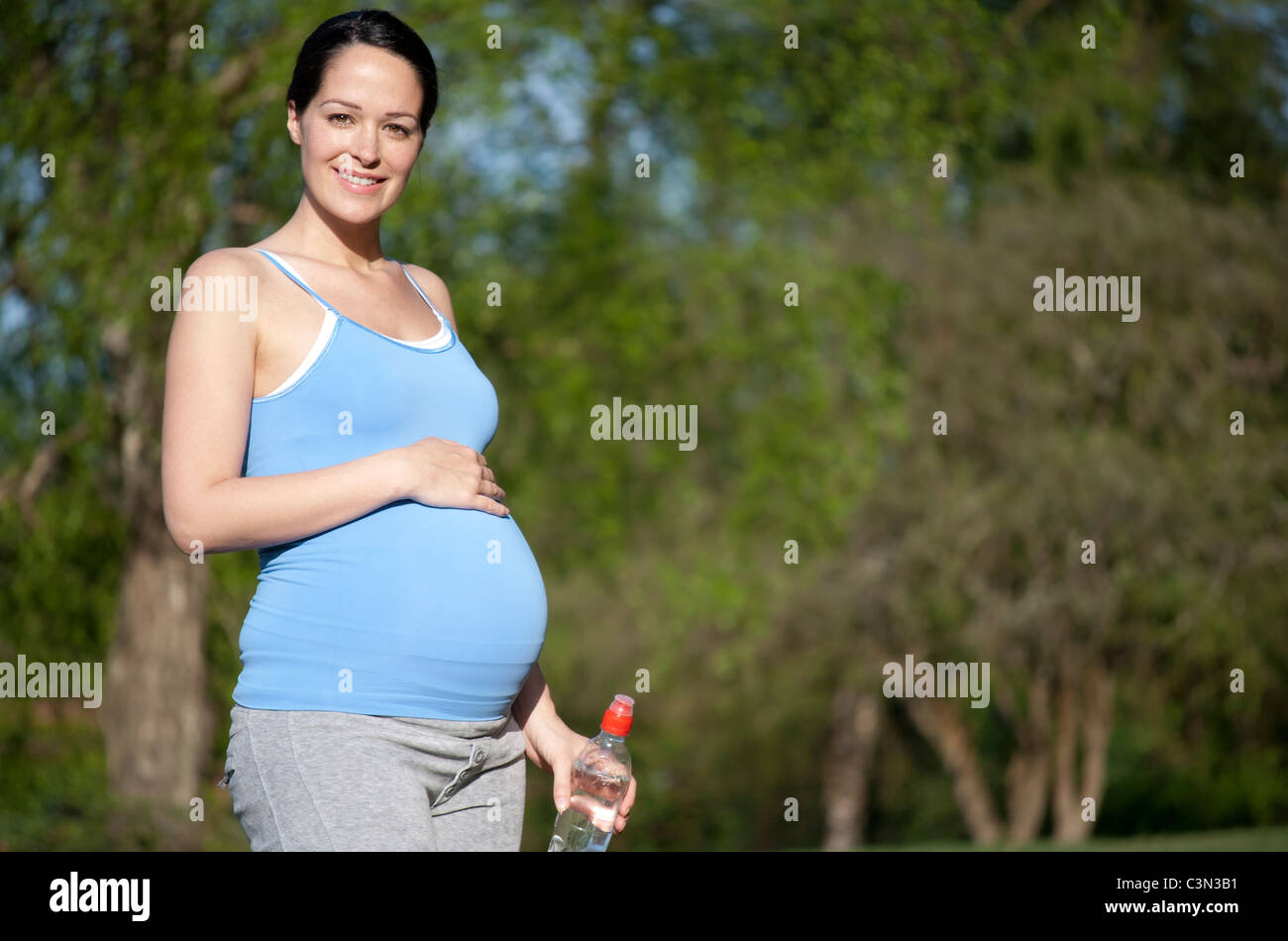 Healthy pregnant woman holding bottle of water Stock Photo Alamy
