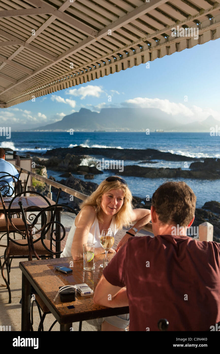 South Africa, Cape Town, Blouberg beach. Restaurant: On The Rocks. Outdoor terrace. Background: Table mountain. Stock Photo