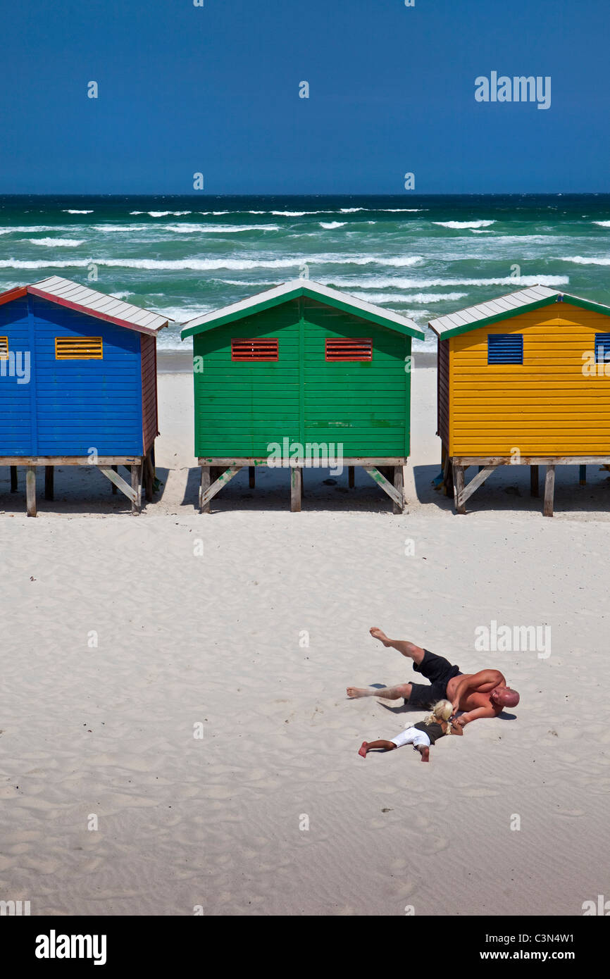 South Africa, Western Cape, Muizenberg, beach huts and family. Stock Photo