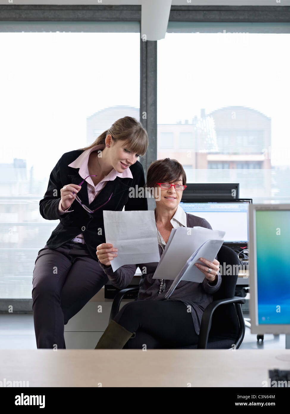 Two business women in a meeting Stock Photo - Alamy