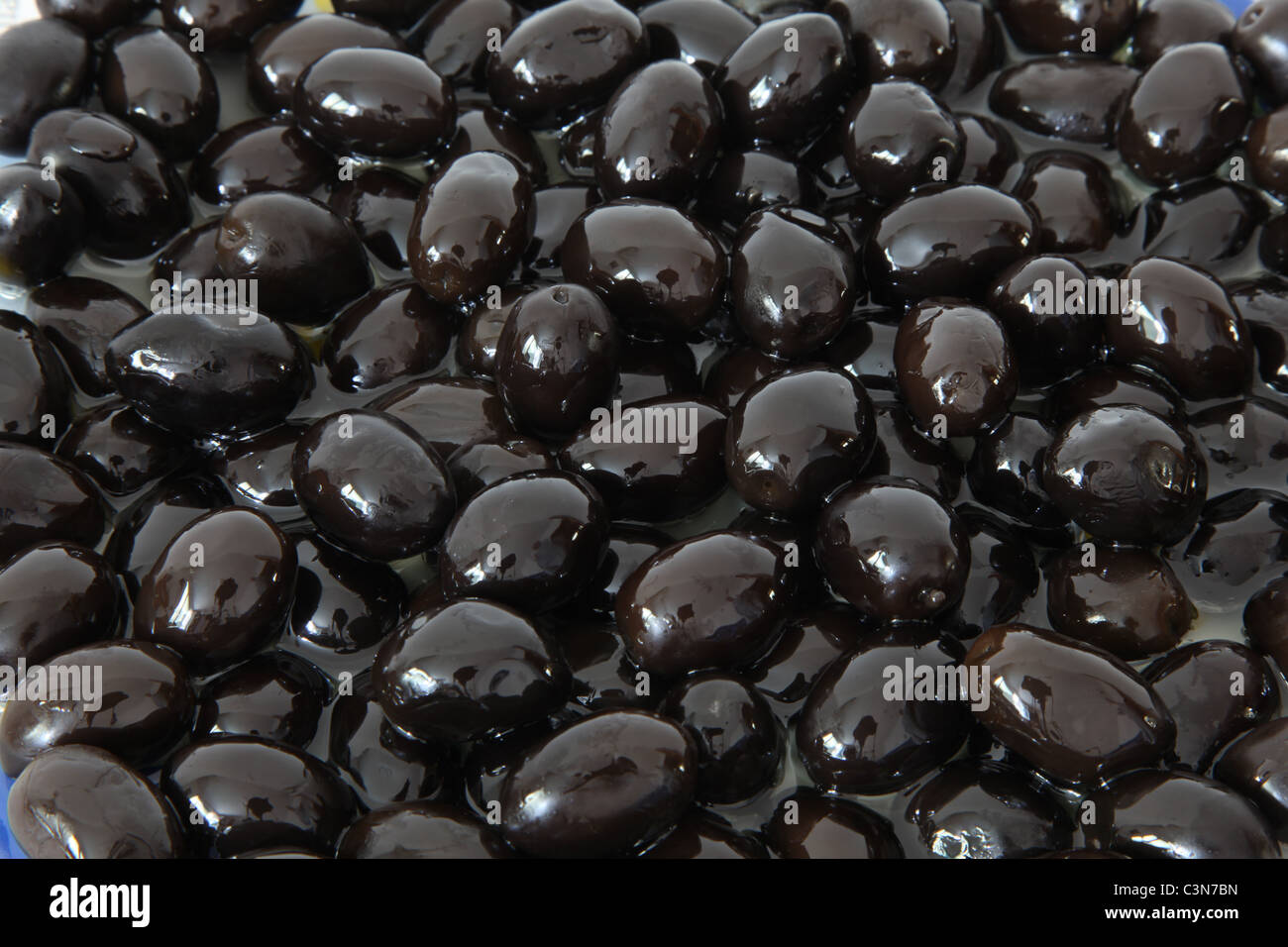 Black olive in olive oil Stock Photo Alamy