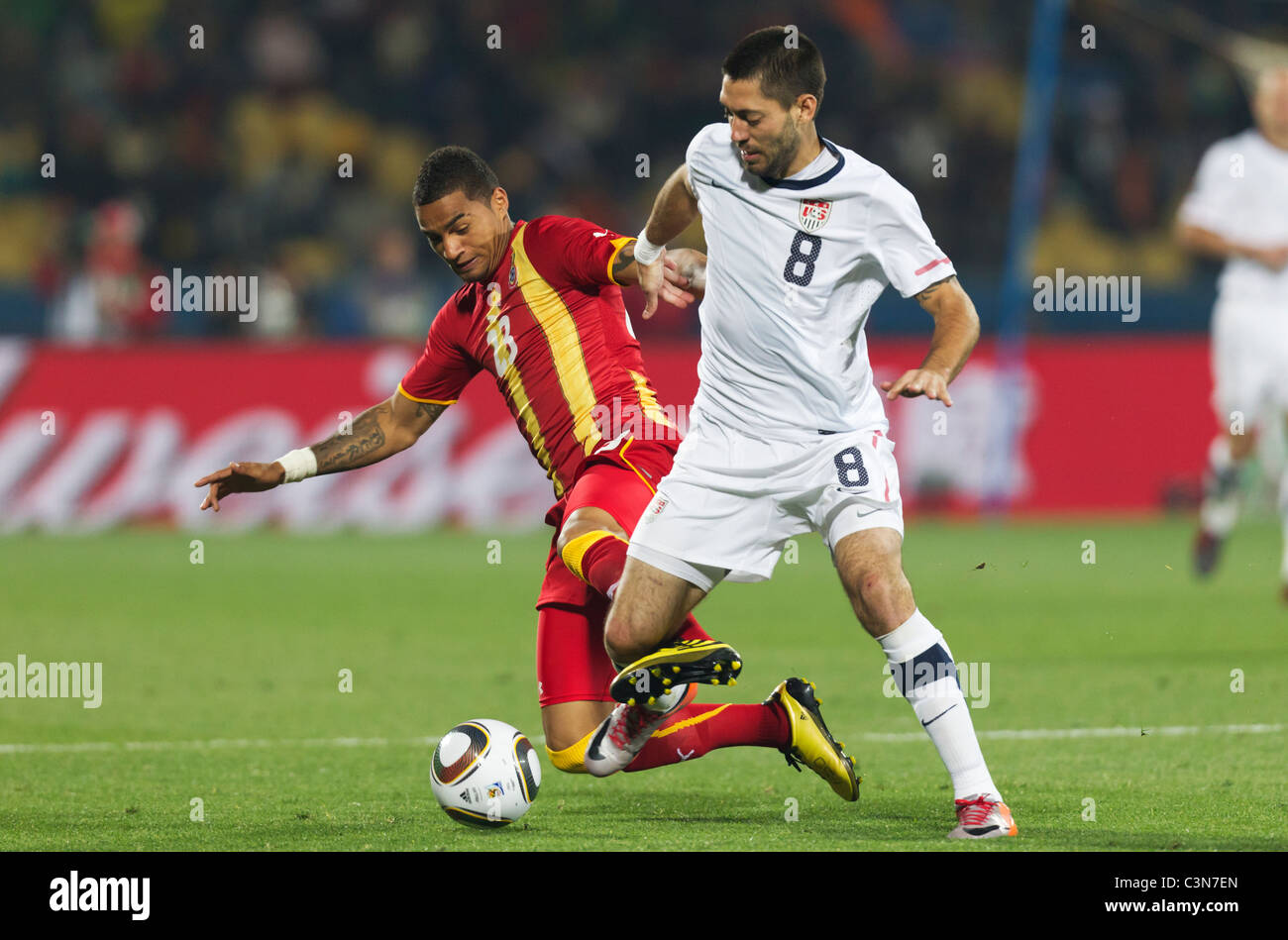 Kevin Prince Boateng of Ghana (l) tries to tackle the ball from Clint Dempsey of the USA (r) during a 2010 World Cup match. Stock Photo