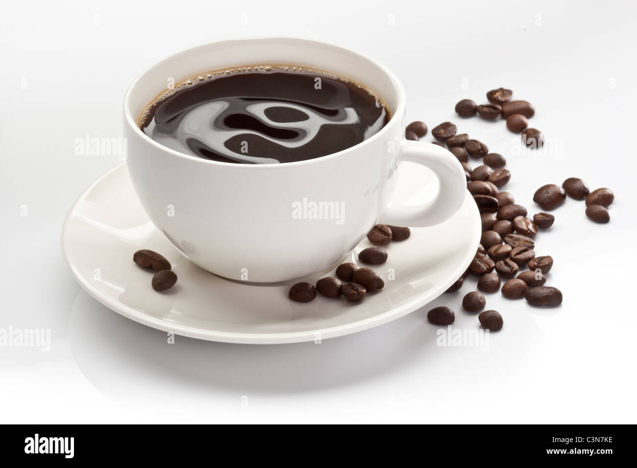 cup of coffee with coffee beans on white background Stock Photo - Alamy