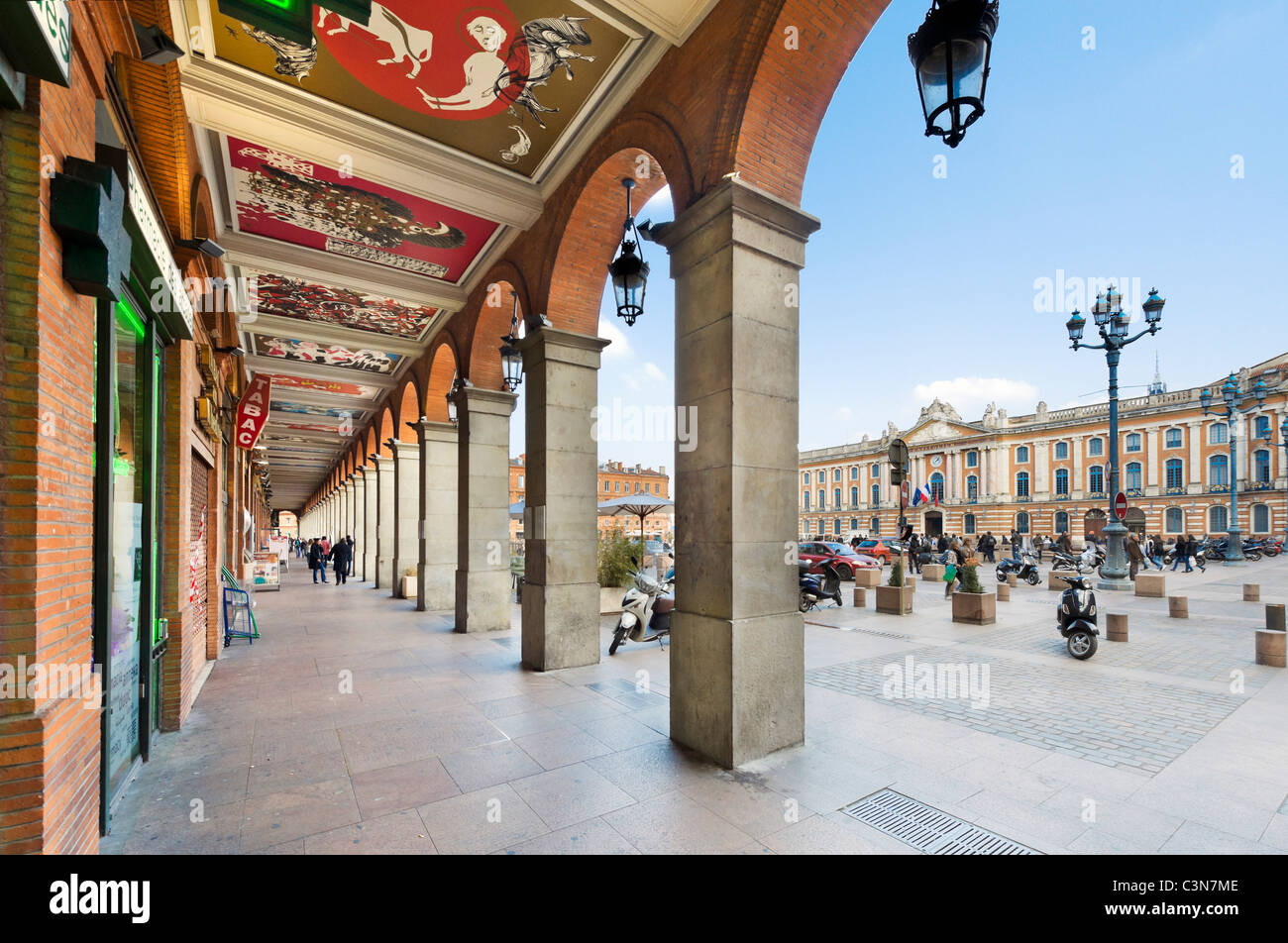 Shops on an arcade in the Place du Capitole in the city centre, Toulouse, Languedoc, France Stock Photo