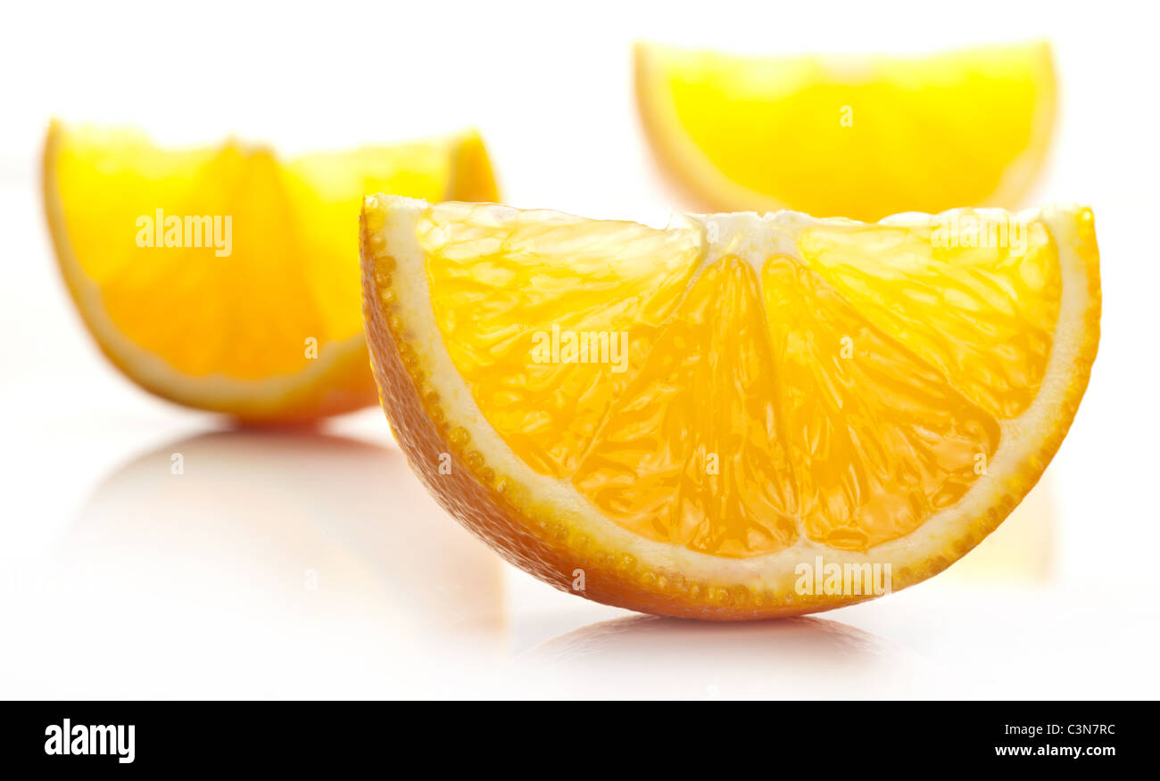 Orange slice on a white background. Stock Photo
