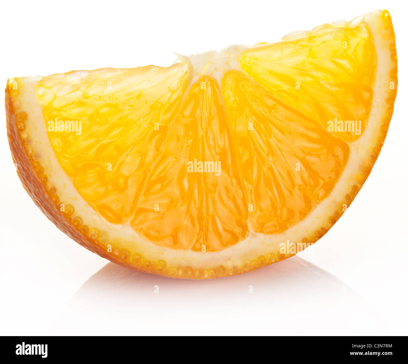 Orange slice on a white background. Stock Photo